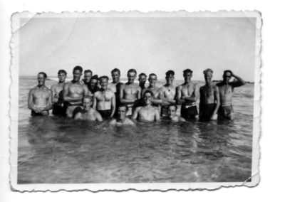 Group of men at the beach in the water