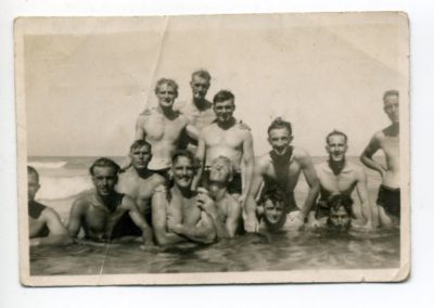 Group of men at the beach in the water