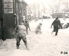 Group of men in uniform playing in the snow